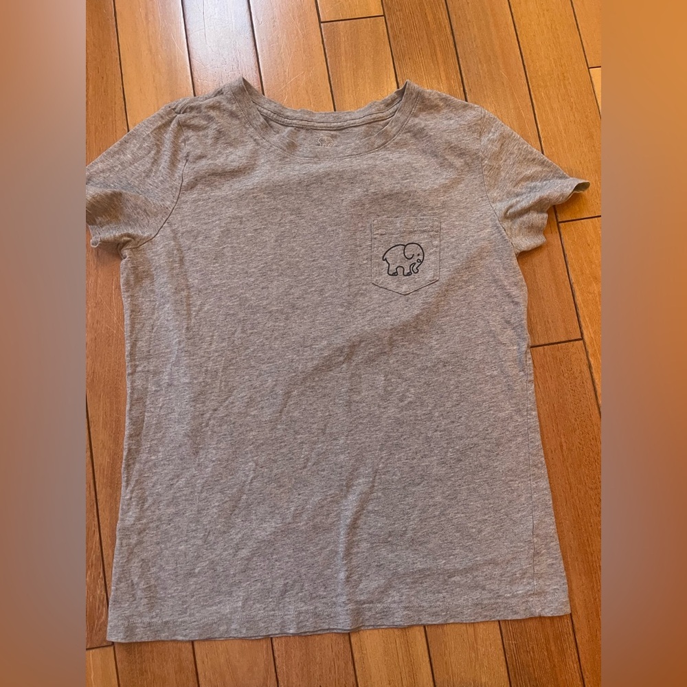 Woman’s S Ivory Ella grey t-shirt with an elephant playing with a soccer ball